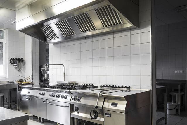 Smoke ventilation for the food industry fitted above cookers in a large kitchen